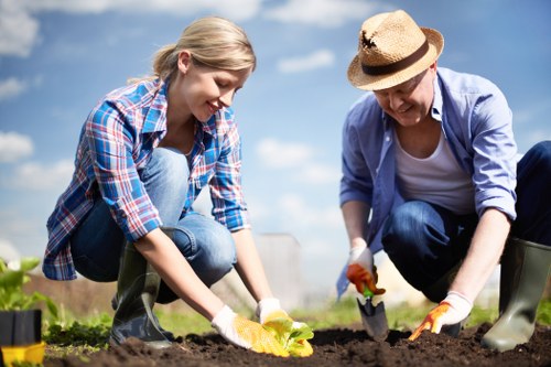 Front view of a gardener inspecting a garden